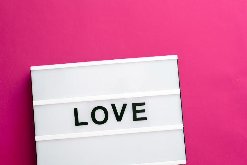 Free Stock Photo: Love message lightbox with changeable black letters on white table box over pink background with copy space