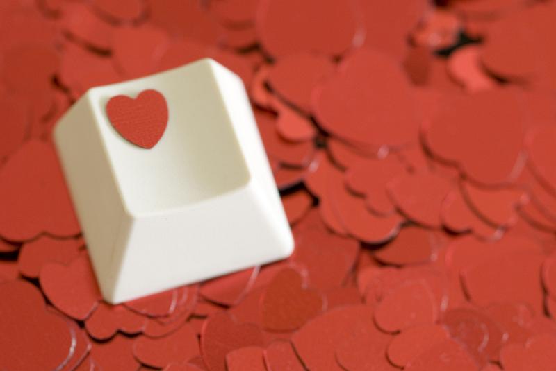 Free Stock Photo: a computer key with a heart symbol on a backdrop of red heart shapes, concept of computer or online dating