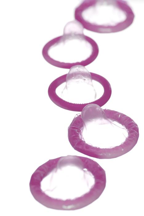 Free Stock Photo: a line of pink coloured condoms, conceptual of safer sex