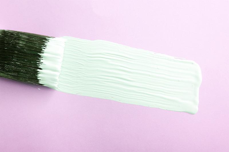 Free Stock Photo: Wide white paint stroke across a pink background with a bristle brush in a creativity, background for a valentine makeover concept