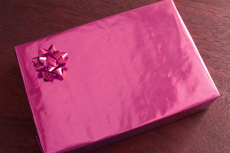 Free Stock Photo: Romantic, pink Valentines gift with a bow for a sweetheart viewed high angle with copy space on the wrapping for your greeting