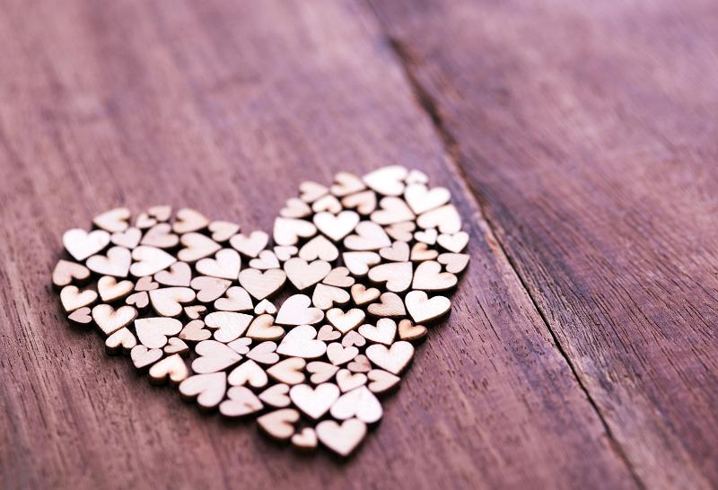 Free Stock Photo: Heart shape composed of little wooden hearts, over lacquered wooden table surface with copy space. Love Valentine concept
