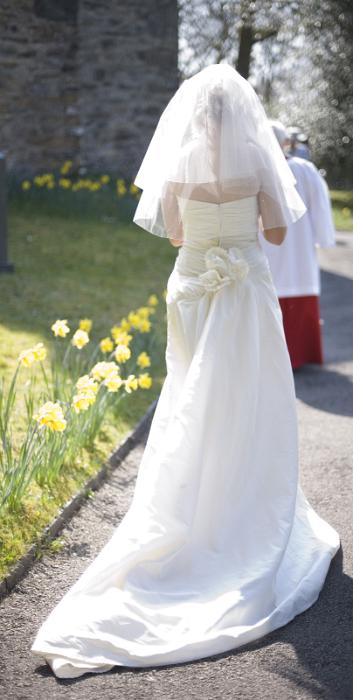 Free Stock Photo: the wedding bride walking to the church door along a path lined with flowers