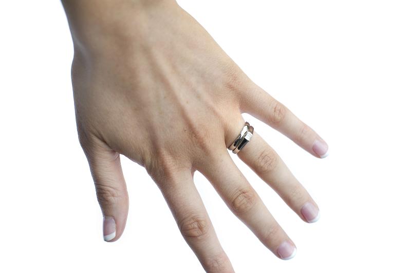 Free Stock Photo: a female hand with wedding and engagement rings on the ring finger