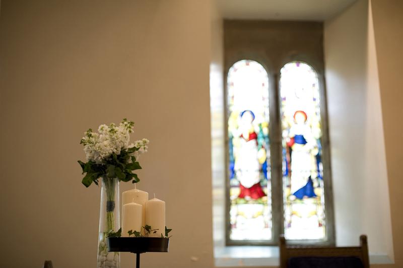 Free Stock Photo: a still life image featruing a chruch window and floral decorations composed of english stocks