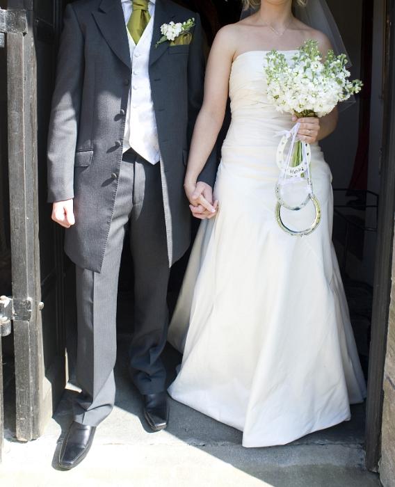 Free Stock Photo: a wedding couple stepping out of the church after the marriage ceremony