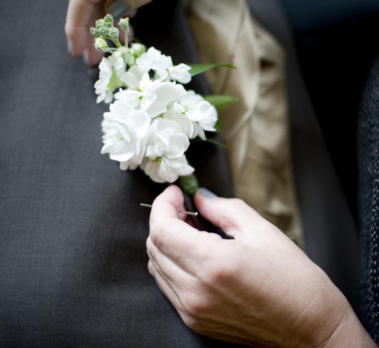 Free Stock Photo: pinning a buttonhole into place before a wedding
