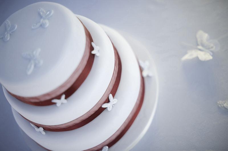 Free Stock Photo: a wedding cake decorated with white butterflys