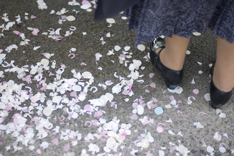 Free Stock Photo: paper and petal confetti on the ground after a wedding