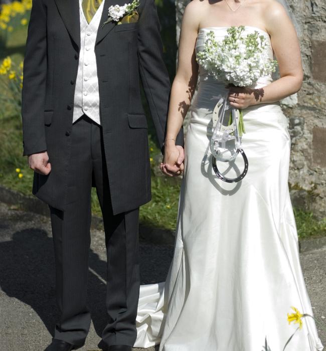 Free Stock Photo: the married couple holding hands outside the church