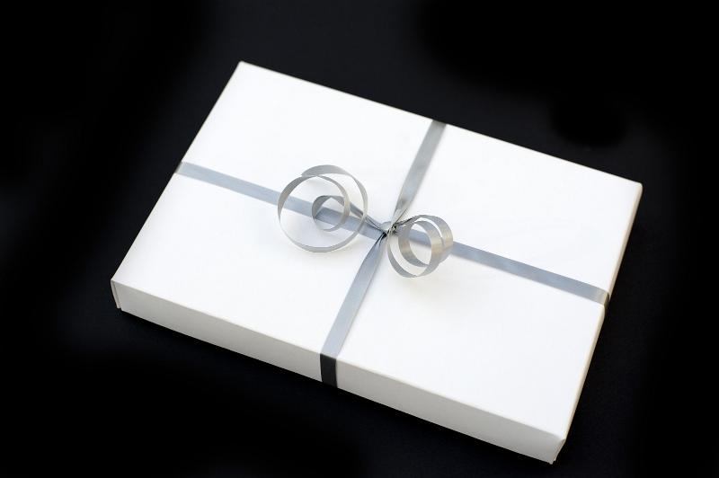 Free Stock Photo: a white wapped wedding present with a silver bow