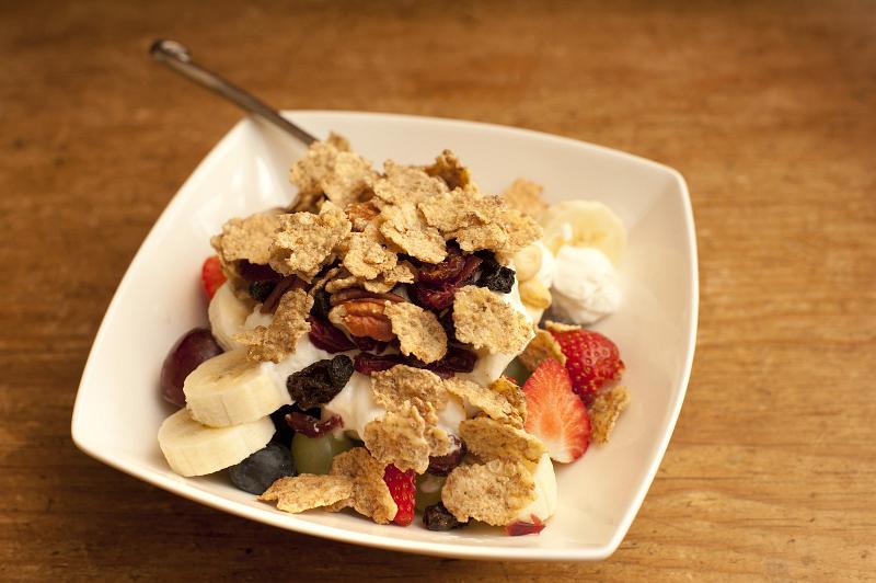 Free Stock Photo: Bowl of healthy muesli with fruit with fresh strawberries, raisins and sliced banana for a healthy breakfast to start the day