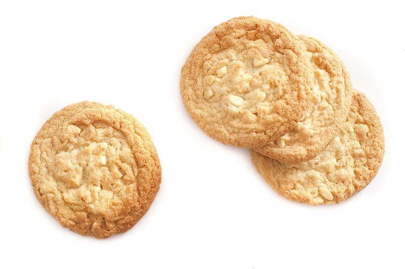 Free Stock Photo: Round golden crunchy biscuits made with oats ready for a tea or coffee break isolated on white