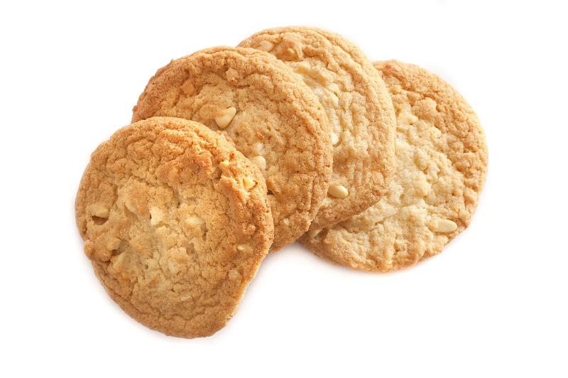 Free Stock Photo: Four golden crunchy oat biscuits arranged in a fan isolated on a white background