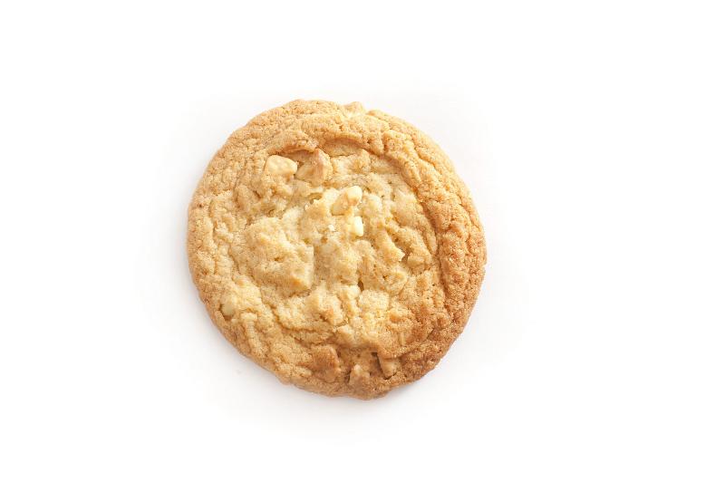 Free Stock Photo: Single round crunchy golden biscuit, overhead view isolated on white