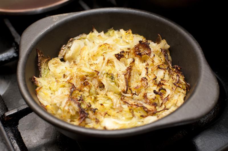 Free Stock Photo: Baked finely sliced fresh cabbage in an oven dish ready for serving as an accompaniment to dinner