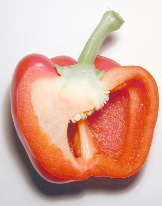Free Stock Photo: Halved healthy red bell pepper or sweet pepper, a member of the capsicum family, rich in vitamins and antioxidants