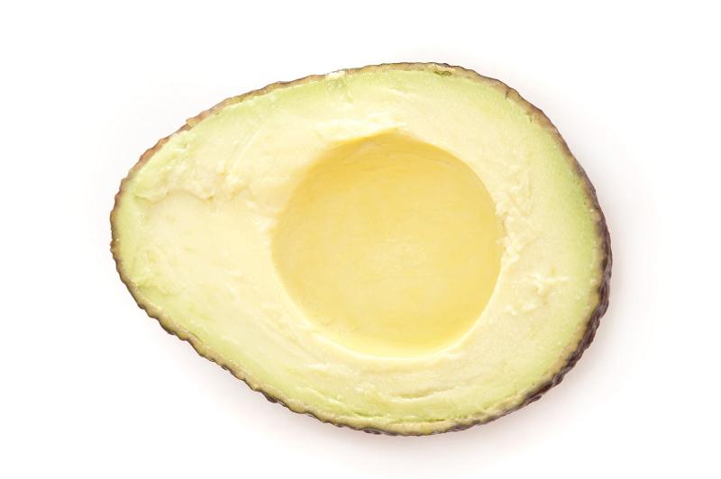 Free Stock Photo: Fresh halved avocado pear on white showing the succulent soft flesh used as a salad ingredient and savory dip