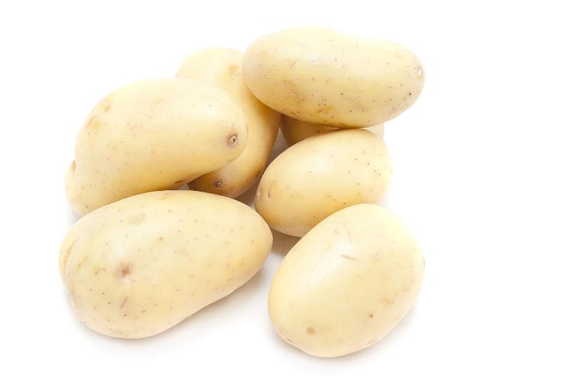 Free Stock Photo: Pile of farm fresh cleaned fresh whole potatoes from farmers market isolated on white with copyspace