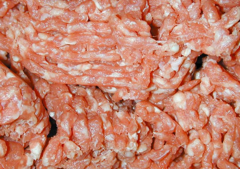 Free Stock Photo: Background texture of raw uncooked mince meat with specks of fat ready for using as an ingredient in cooking