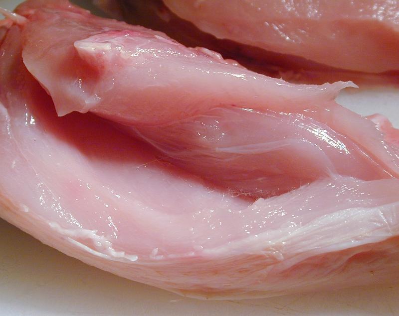 Free Stock Photo: Texture of raw lean chicken meat with a close up view of a fillet with the skin removed ready for cooking