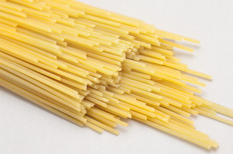 Free Stock Photo: Dried Italian spaghetti pasta made from durum wheat dough and a source of carbohydrate in the diet
