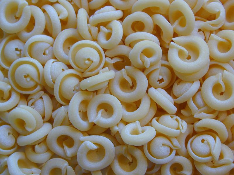 Free Stock Photo: Background texture of dried coiled pasta made from durum wheat and eggs for use in Italian cuisine