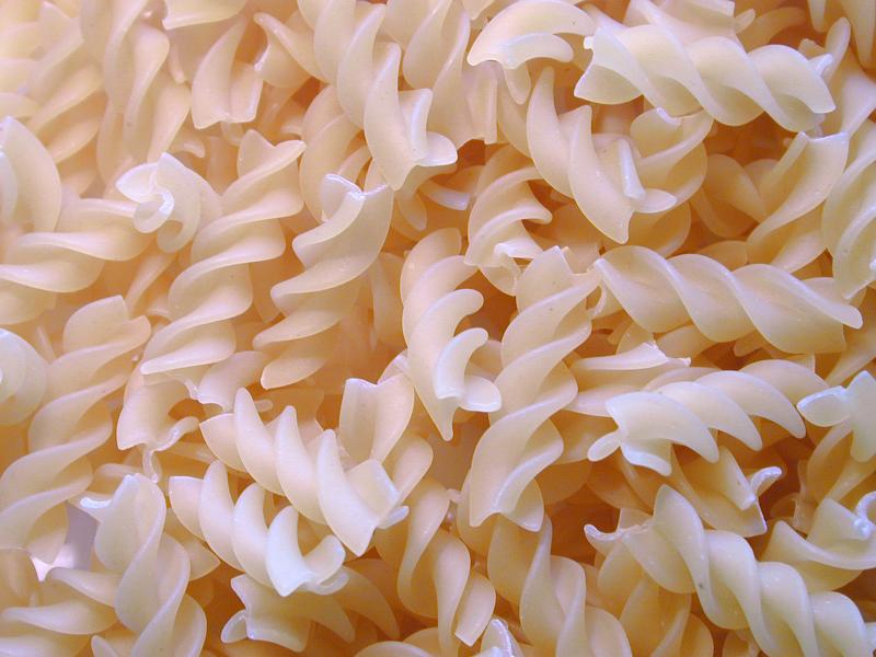 Free Stock Photo: Background texture of uncooked dried spiral twist Italian pasta made from durum wheat and eggs