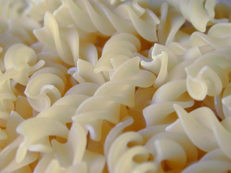 Free Stock Photo: Background texture of spiral dried Italian fusilli pasta for a healthy Mediterranean cuisine
