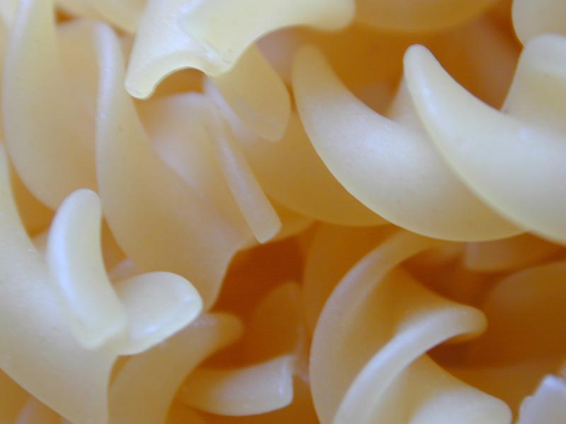 Free Stock Photo: Close up background texture of cooked plain spiral pasta in the distinctive twisted form of Italian fussili