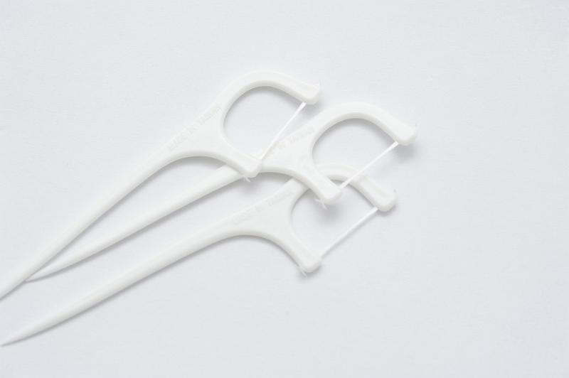 Free Stock Photo: three dental tooth floss picks on a white background