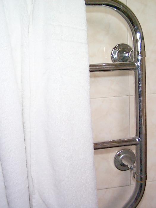 Free Stock Photo: an electric towel rail with white towel on it