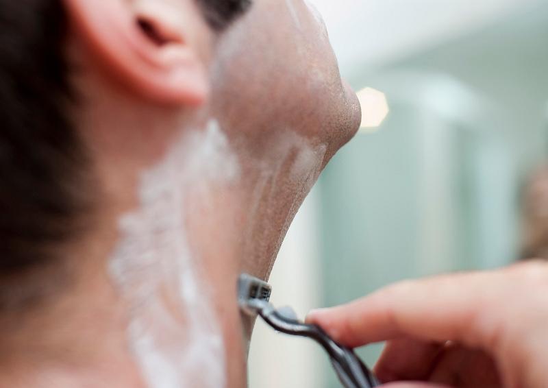 Free Stock Photo: a man shaving with a blade razor