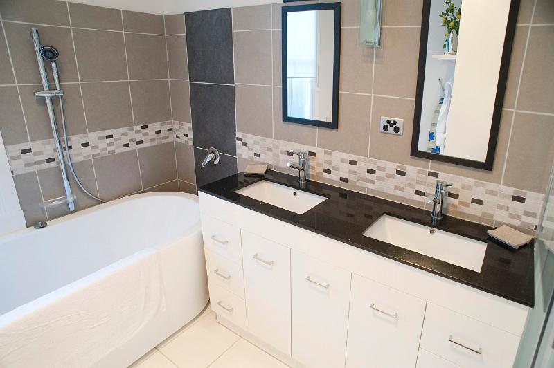 Free Stock Photo: a modern domestic bathroom with baths and dual sinks