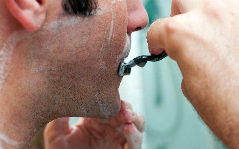 Free Stock Photo: a man shaving with shaving foam and a blade safety razor