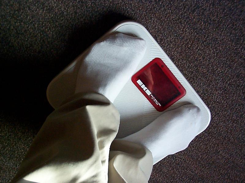 Free Stock Photo: getting weighed on a set of digital bathroom scales