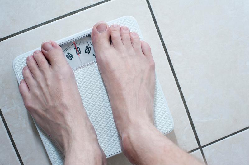 Free Stock Photo: looking down on feet standing on mechanical bathroom scales