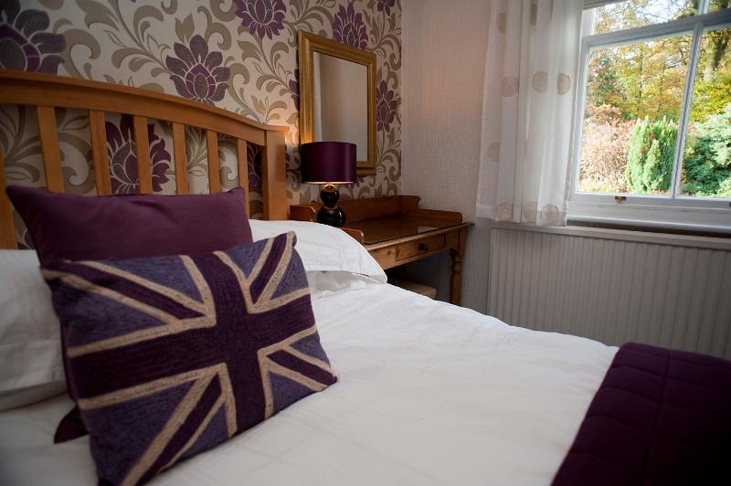 Free Stock Photo: Union Jack pillow on a bed in a patriotic British bed and breakfast accommodation