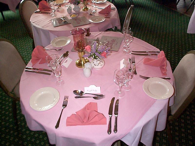 Free Stock Photo: Elegant formal dining table with pink decor at a catered event or reception set with stylish linen, silverware and glassware, high angle view