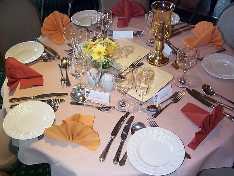 Free Stock Photo: Formal dinner table at a catered event with elegant linen and silverware with name tags and place settings