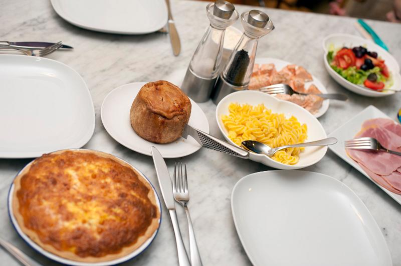 Free Stock Photo: a marble dining table with a selection of cold pies and meats