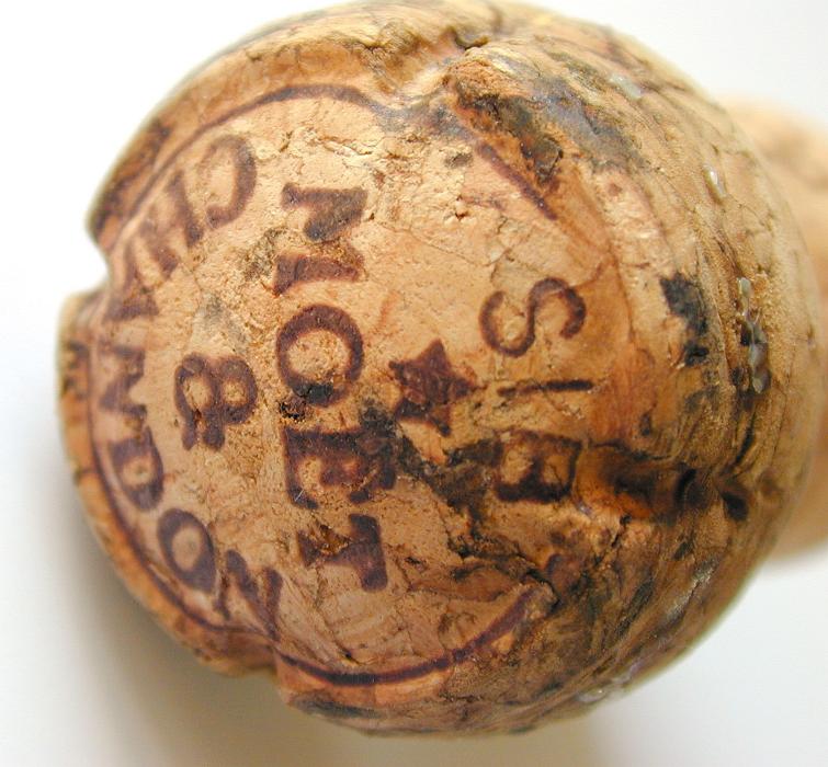 Free Stock Photo: Close up of the top of a Moet and Chandon champagne cork showing the labeling and vintage