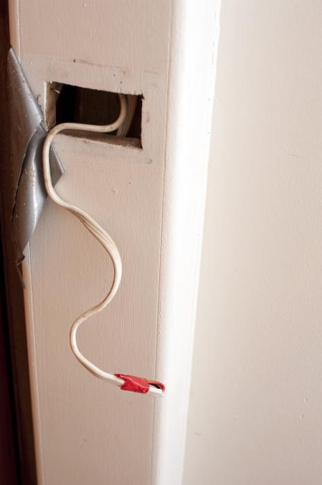 Free Stock Photo: Domestic electric wiring during the renovation process with a taped off wire protruding from an access hole in the wall
