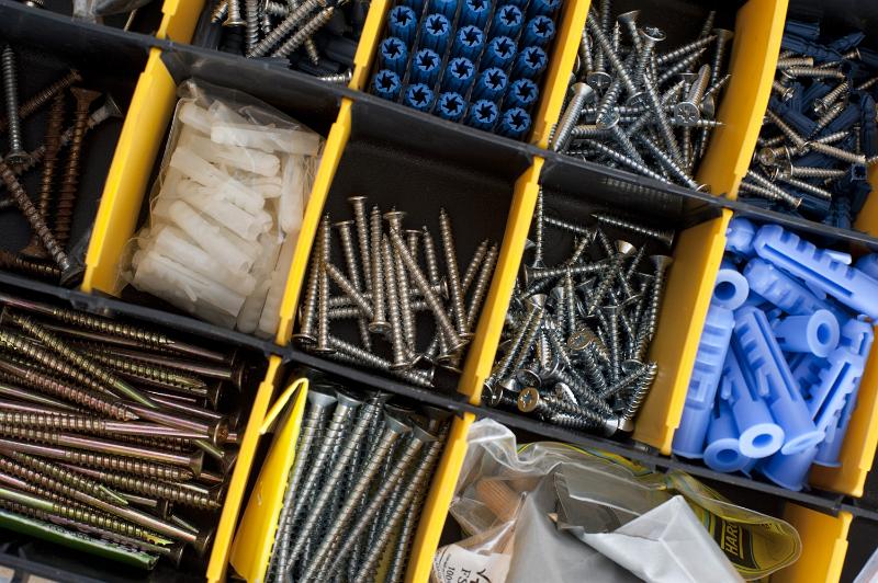 Free Stock Photo: Carpenters tool box with assorted screws and plugs in separate compartments viewed closeup from above in a DIY or woodworking background