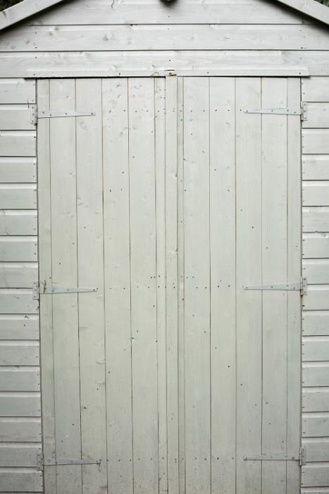 Free Stock Photo: Close white painted double wooden shed doors in a close up full frame architectural view