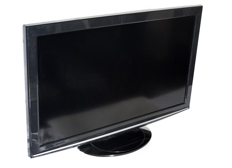 Free Stock Photo: Modern flat black TV set or PC monitor with wide LCD screen turned off, close-up with copy space on white