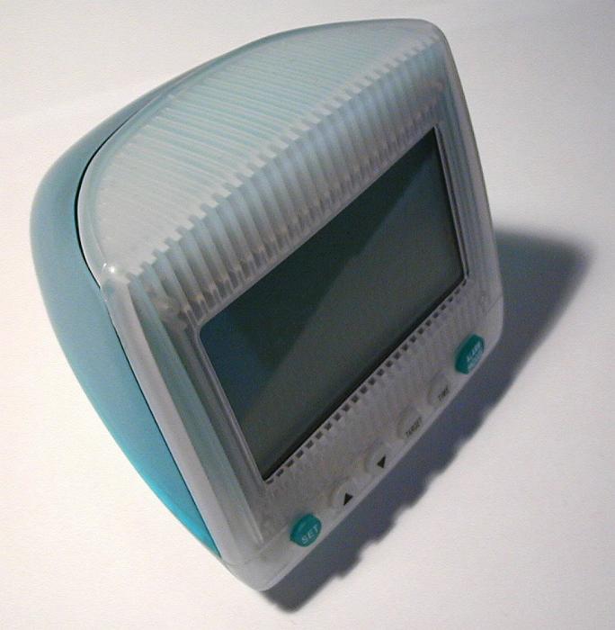Free Stock Photo: Plastic desk electronic clock designed as a blue and gray PC monitor or CRT TV set, close-up with shadow and copy space on gray