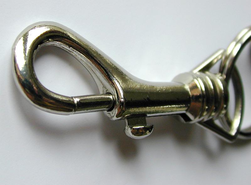 Free Stock Photo: Closed metallic key locker ring, close-up with shadow on gray background