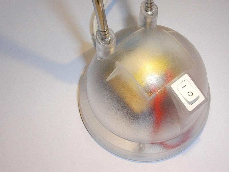 Free Stock Photo: Close Up of Transparent Lamp Base with Visible Electrical Components and Switch in On Position