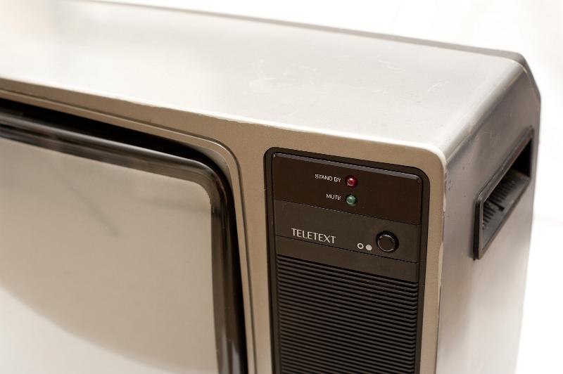 Free Stock Photo: Close Up Detail of Vintage Television Set with Focus on Power Buttons